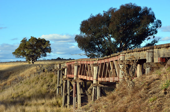 Fototapeta Old abandoned wooden railway bridge over the Boorowa River, in rural central west NSW, Australia
