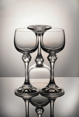  three empty glasses stand on the table