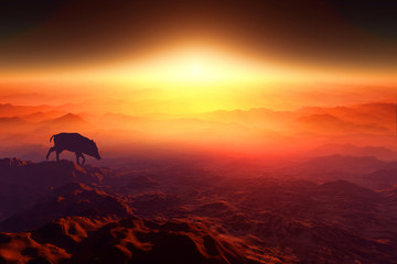 日の出とイノシシのシルエット
