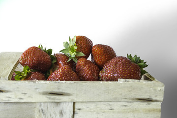 Berries ripe strawberry in bast basket for berries. Isolated image on white background. Photo for...