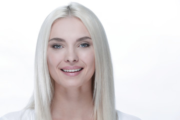 Close-up of a beautiful woman with blonde straight hair and daytime make-up