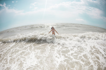 Woman bathing in the ocean.