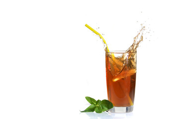 Splashes of iced tea from lemon slice on white isolated background.