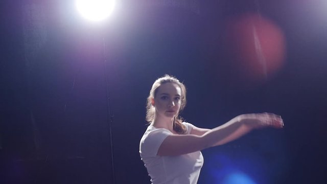 modern style dancer dancing on a black background