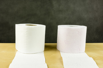White and red roll of soft toilet paper.