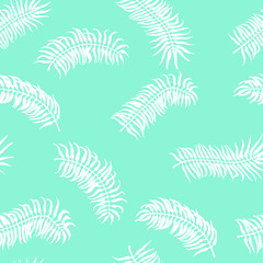 Seamless tropical pattern. Palm leaves on the blue background