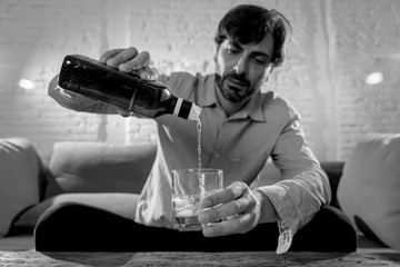 latin businessman drunk and depressed at home in alcoholic concept