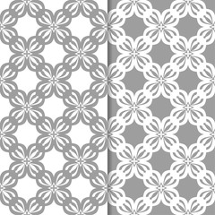White and gray floral backgrounds. Set of seamless patterns