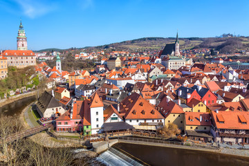 Naklejka na ściany i meble Aerial view panorama of the old Town of Cesky Krumlov in South Bohemia, Czech Republic with blue sky. UNESCO World heritage Site and famous place for tourism