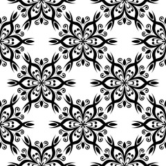 Black flowers on white background. Ornamental seamless pattern
