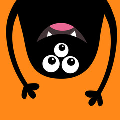 Smiling monster head silhouette. Thtee eyes, teeth, tongue, hands. Hanging upside down. Black Funny Cute cartoon character. Baby collection. Happy Halloween card. Flat design. Orange background.