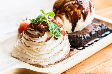 Brownies and ice cream in wood bowls to creative for design and decoration isolate on background.Copy space.