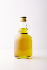 bottle of extra virgin olive oil isolated on grey background