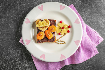 Plate with creative sweet toast on table