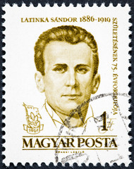 A stamp printed in Hungary shows a portrait image of Latinka Sandor