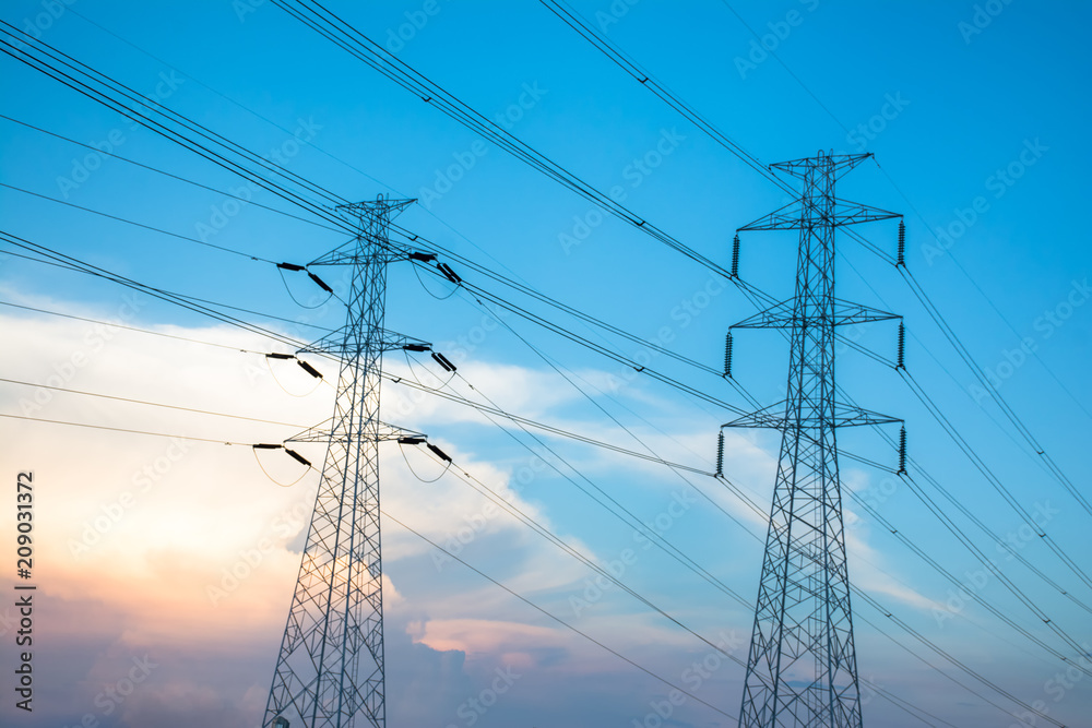 Wall mural high voltage power tower and power lines at sunset.