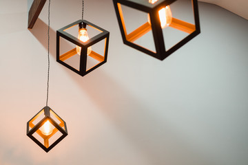 Group of modern luxury light lamp, edison lamp square box shape hanging down from ceiling in gray...