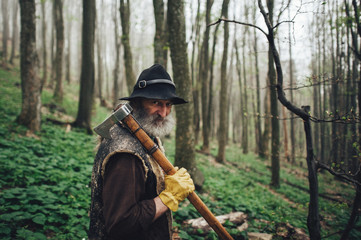 Portrait of a senior man walking in the forest