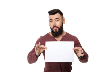 bearded man holding white card.