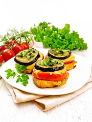 Appetizer of aubergines and cheese on board