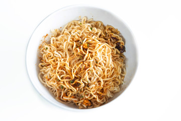 Instant noodles spicy ready to eaton in the bowl on white table wooden.