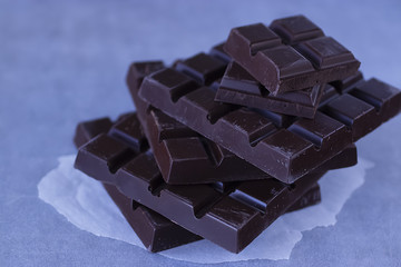 Organic chocolate on white paper. Homemade.