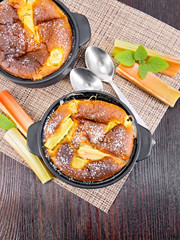 Klafuti with rhubarb in brazier on board top