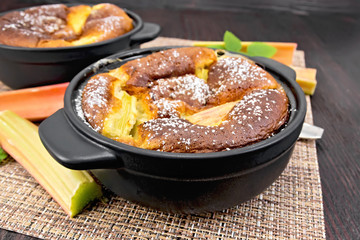 Klafuti with rhubarb in brazier on dark board