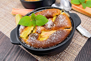 Klafuti with rhubarb in brazier on table