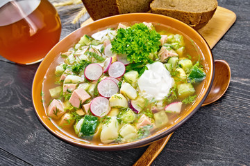 Okroshka in bowl on board