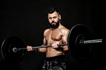 Fototapeta na wymiar athletic muscular man workout with barbell