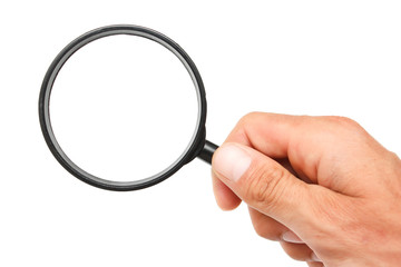 Man's hand with magnifying glass.