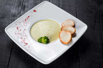 Lentils cream soup on wooden background