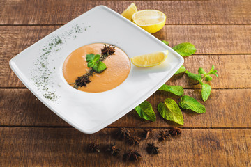 Lentils cream soup on wooden background