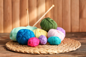 Colorful knitting yarn on wicker mat