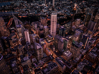 Tall buildings in the city and in the evening from above