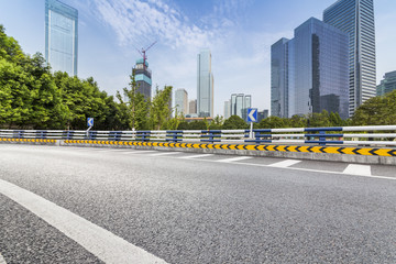 Fototapeta premium Panoramic skyline and modern business office buildings with empty road,empty concrete square floor