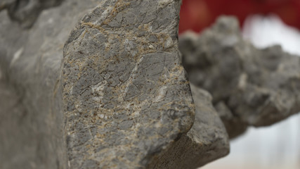 In the piece of rock, the barely visible minerals of the minerals are visible.