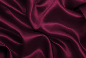 Smooth elegant pink silk or satin luxury cloth texture as abstract background. Luxurious background...