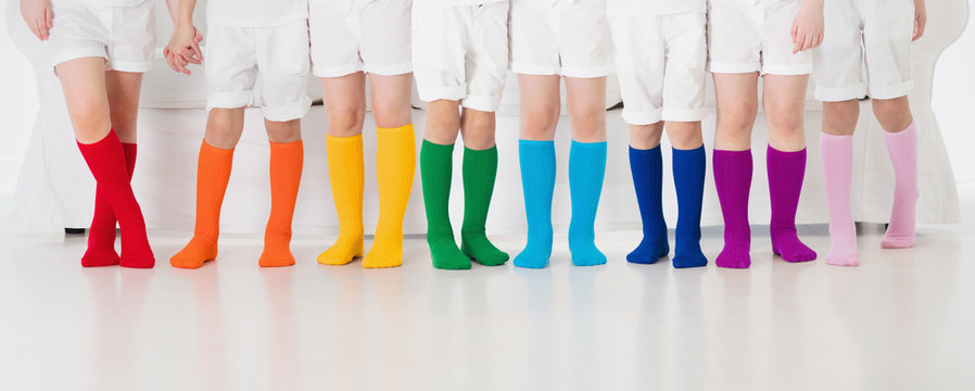 Kids with colorful socks. Children footwear.