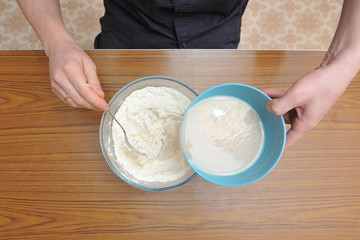Prepare the dough for homemade pizza, hand knead the dough with yeast