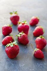  Strawberries ripe on a dark black beton  background. Copy space. Healthy lifestyle concept. 