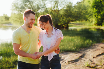 Shot of a young couple bonding trough walking in the nature.