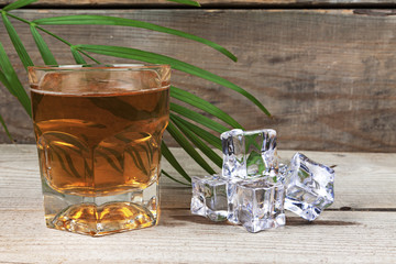 Lemonade in the grocery next to ice cubes.