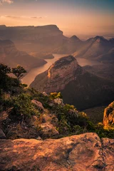 Foto op Plexiglas Portrait Shot of Blyde River Canyon bathed in dreamy warm pinks and oranges during pre-sunset golden hour. Foreground Rock. Mpumalanga, South Africa © Jennifer