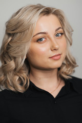 Portrait of young Caucasian blonde girl with Nude makeup with clean skin