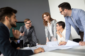 Creative business people working on business project in office