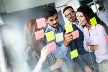 Business people meeting at office and use post it notes to share idea