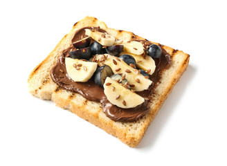 Toasted bread with chocolate paste, blueberry and sliced banana on white background