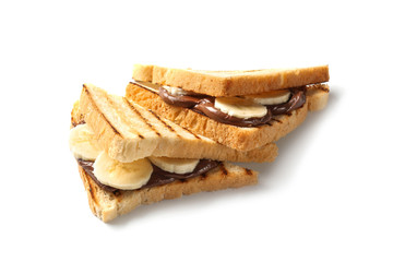 Toasted bread with chocolate paste  and sliced banana on white background